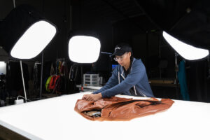 A Trove employee prepares a jacket for photography