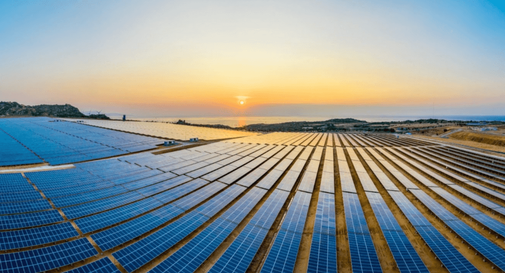 The sun sets over a solar farm
